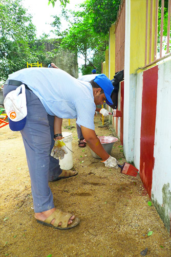 Class President, U. V. Suresh, Paints the Playground's Wall