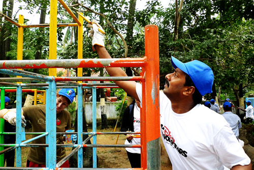 Vijay Anand, Key Account Manager, Disney India, and Rosie Sanderson Paint the Jungle Gym