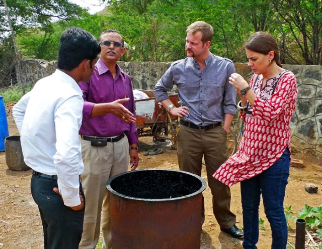 Vijay Bhaskar, Dr. Bhavani Shankar, Ramsey Ford and Kate Hanisian discuss the charcoal production chamber